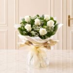 Six Stolen Kisses White flower arrangement by Father’s Day in Lahore for Fathers Day